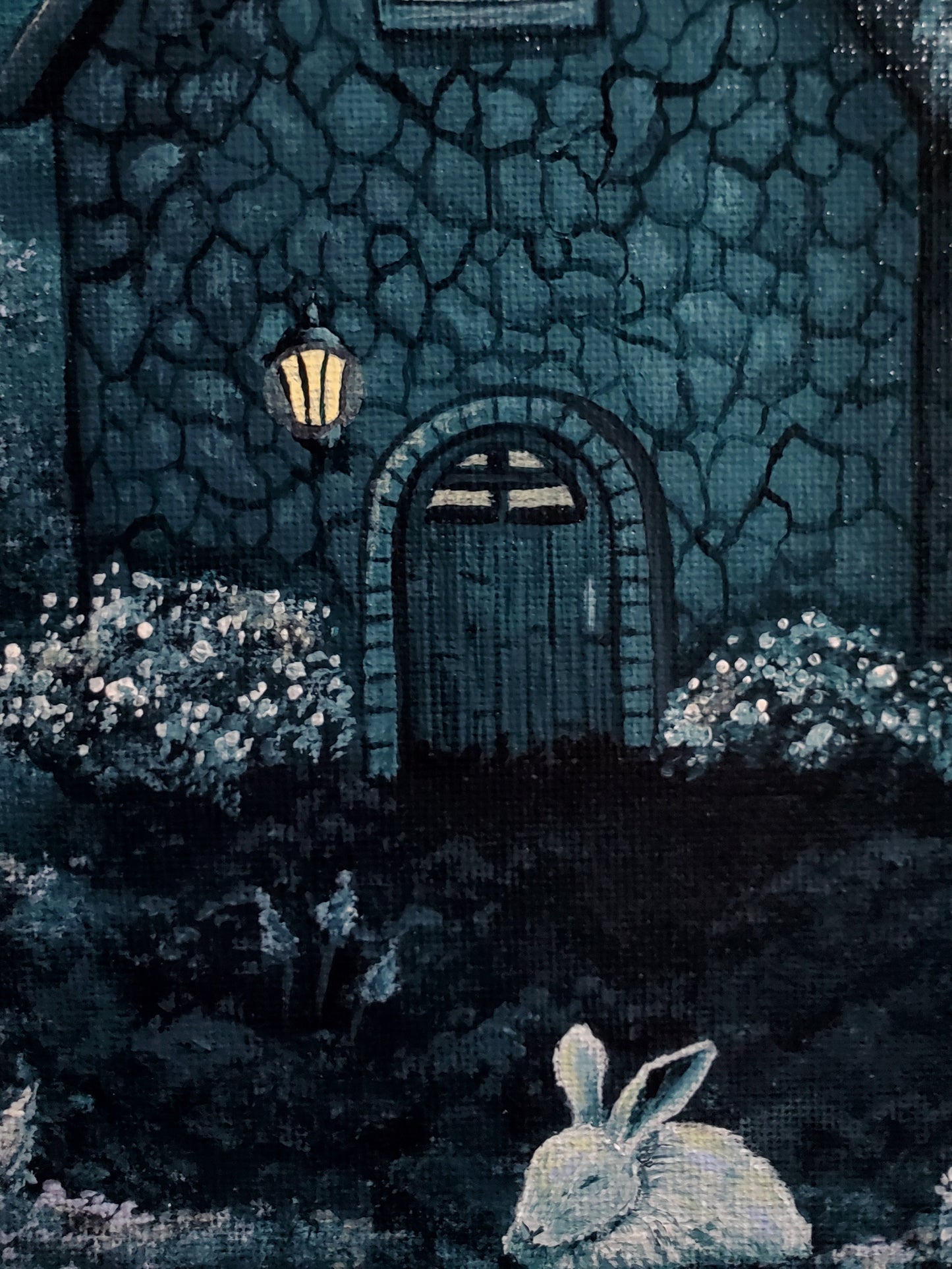 Close up of front door and lantern attached to the home just beside the door to the left